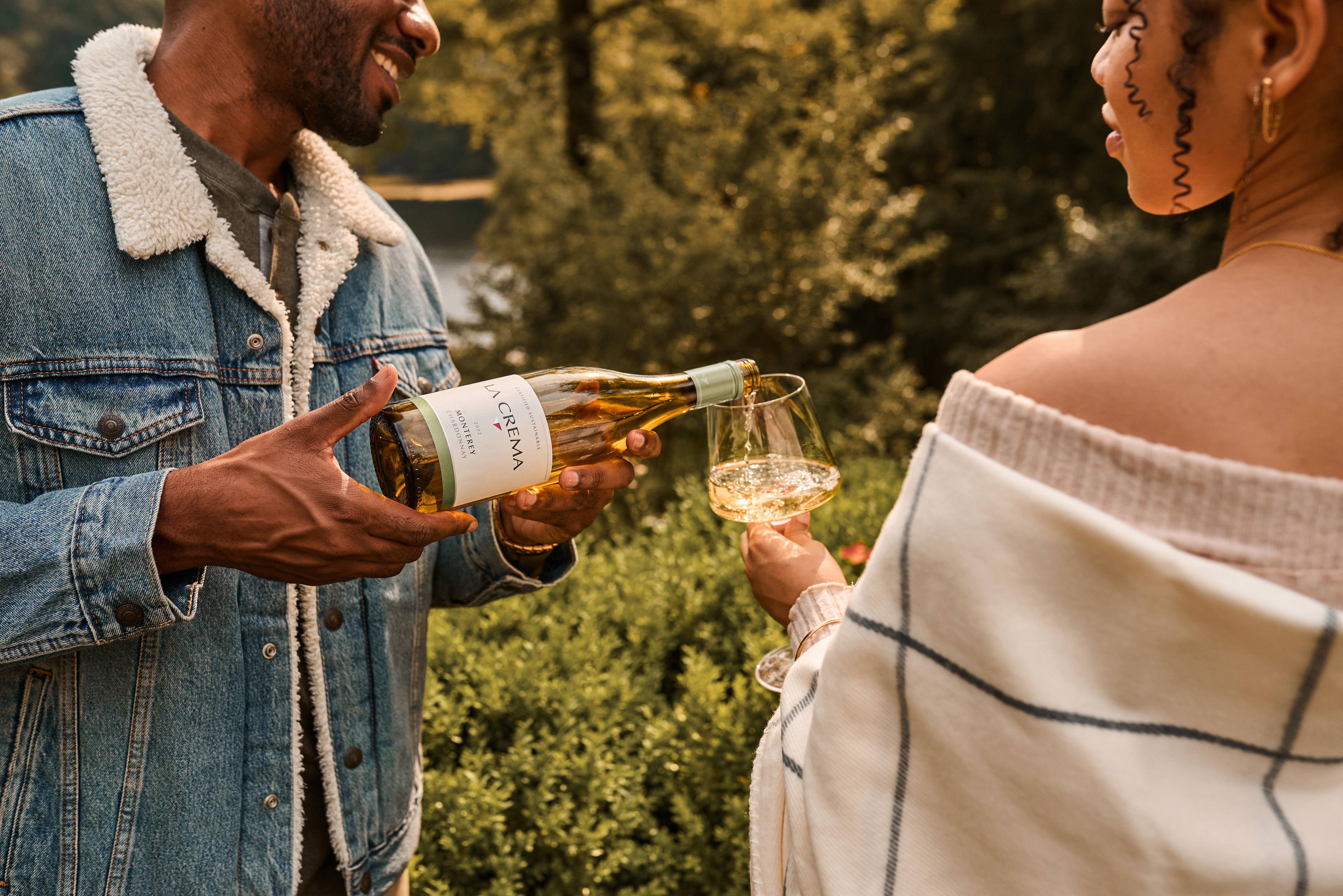 Two friends enjoying a glass of La Crema Chardonnay