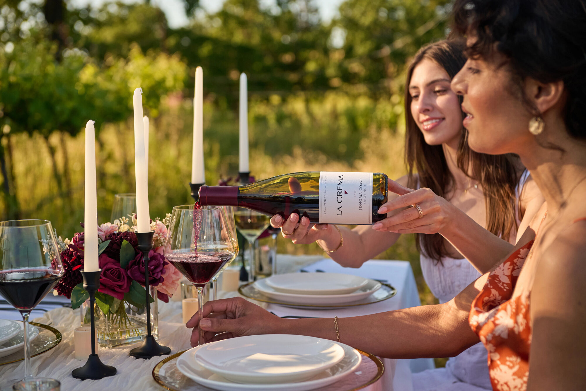 Pouring a glass of Pinot Noir wine