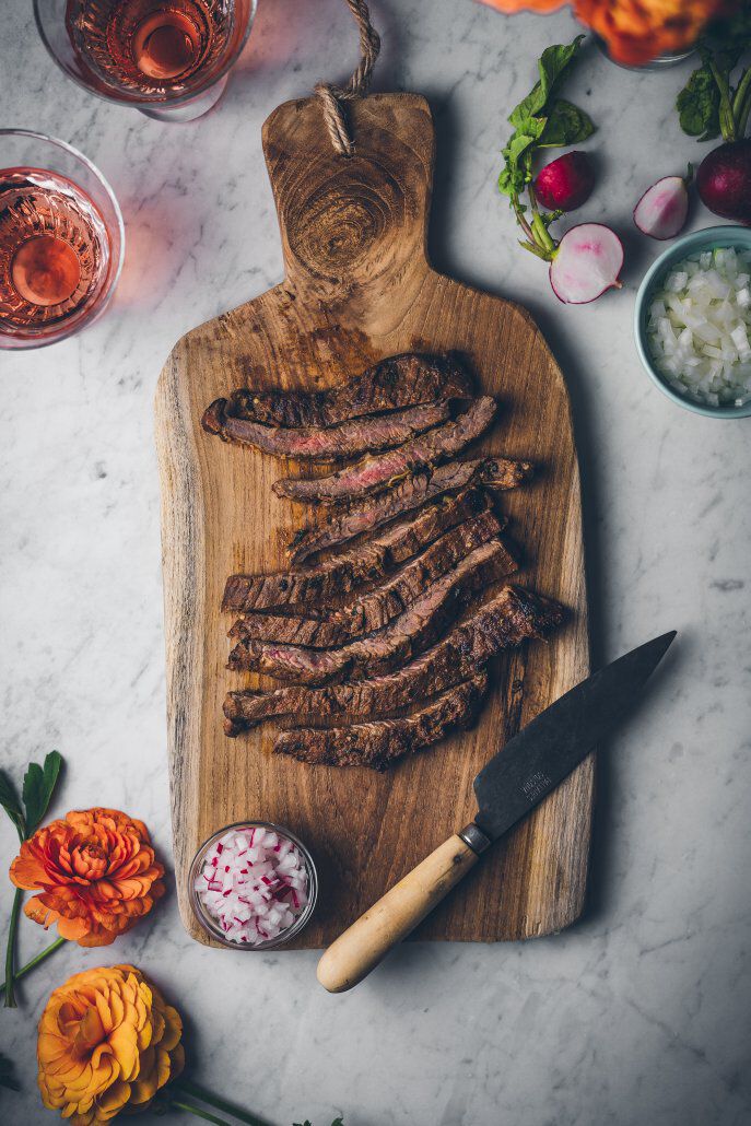 Sliced steak on a cutting board