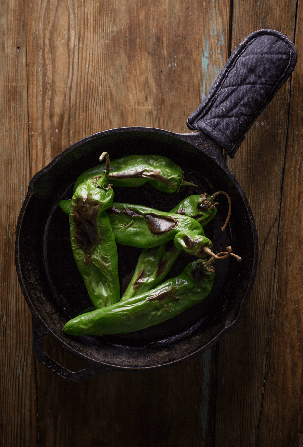 Roasted hatch chiles in a pan