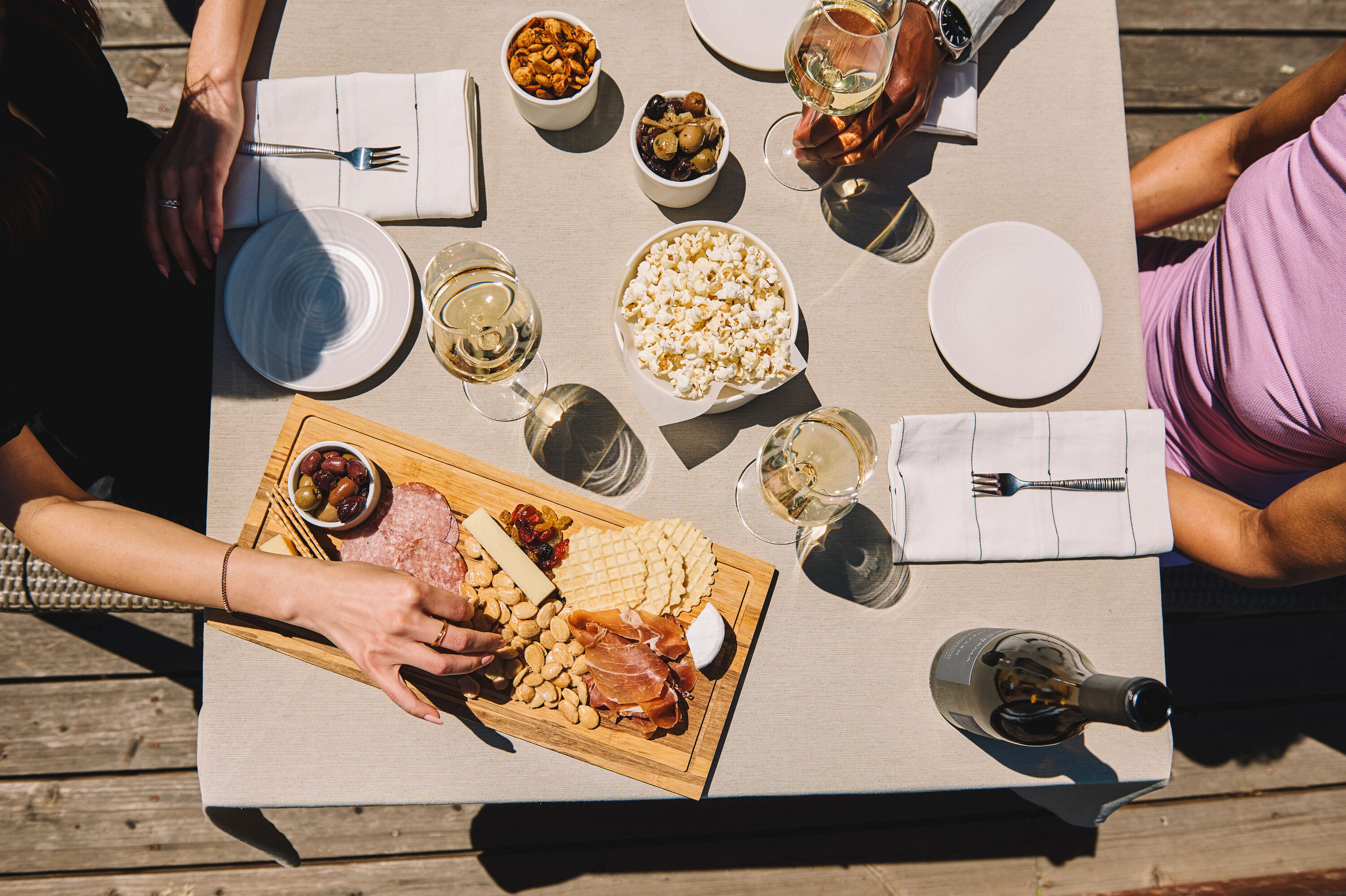 A couple drinking a glass of La Crema outdoors