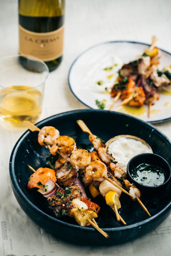 Seafood skewers on a plate with La Crema Chardonnay