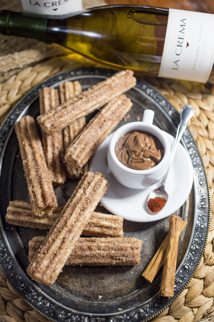 Chocolate ganache with churros and Chardonnay wine