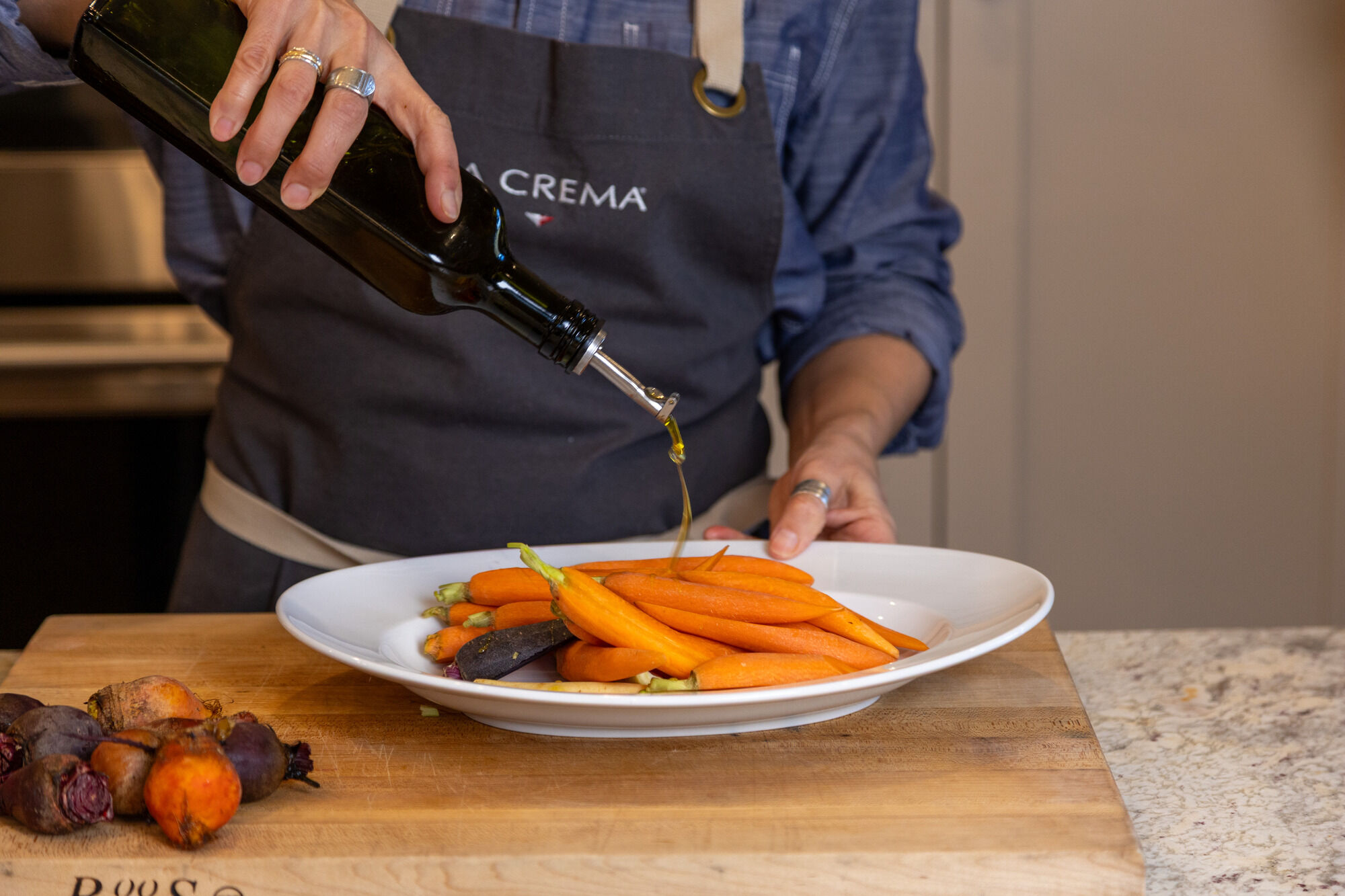 Putting oil on carrots