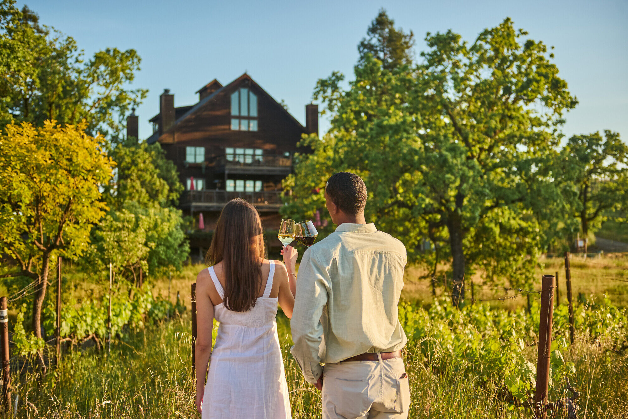 Two people walking the La Crema Estate vineyards