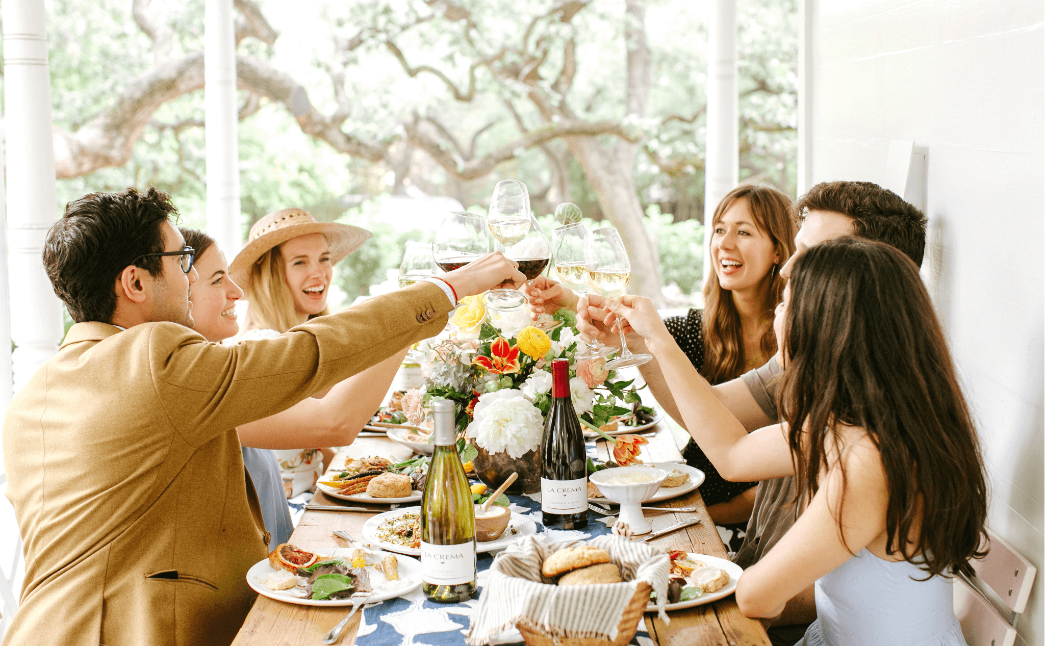 Drinking wine at a wine and cheese tasting party