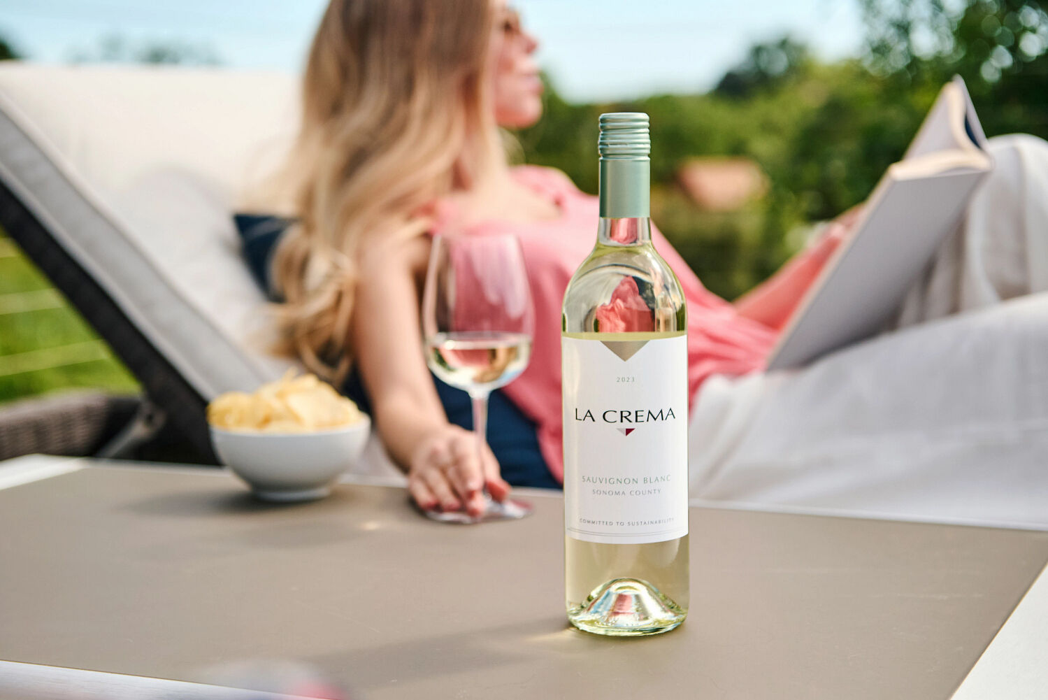 La Crema Sauvignon Blanc wine by the pool