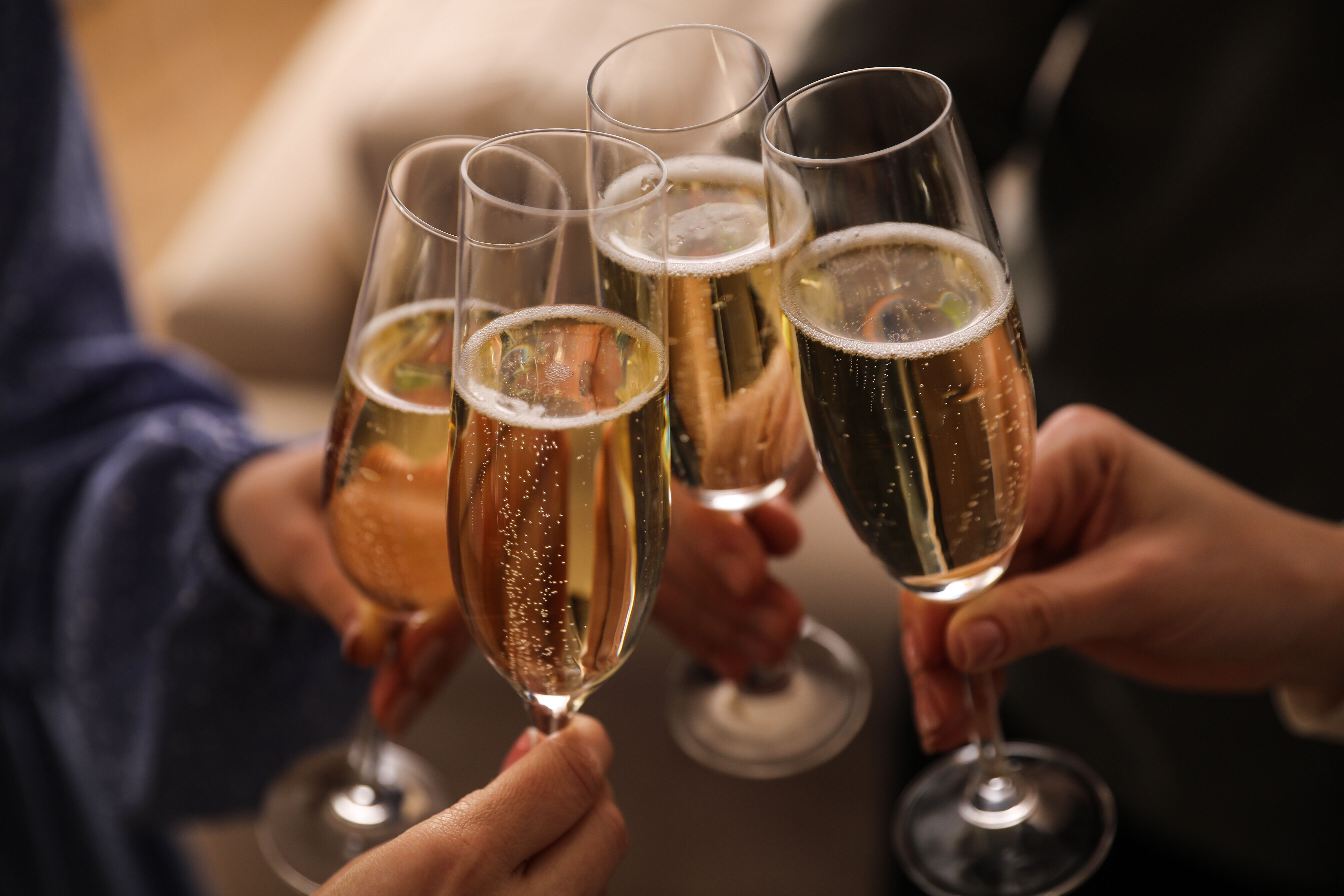 Sparkling wine glasses about to toast