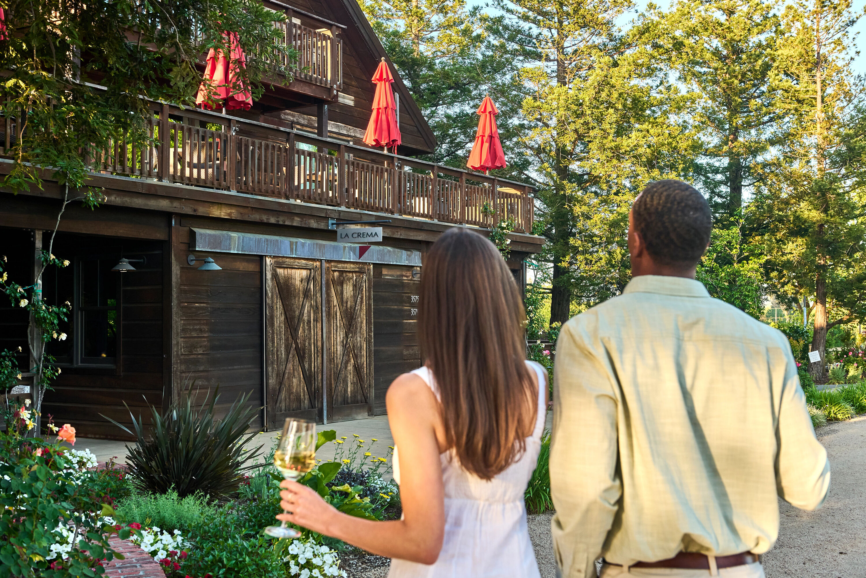 A couple standing outside the La Crema estate about to enjoy a tasting