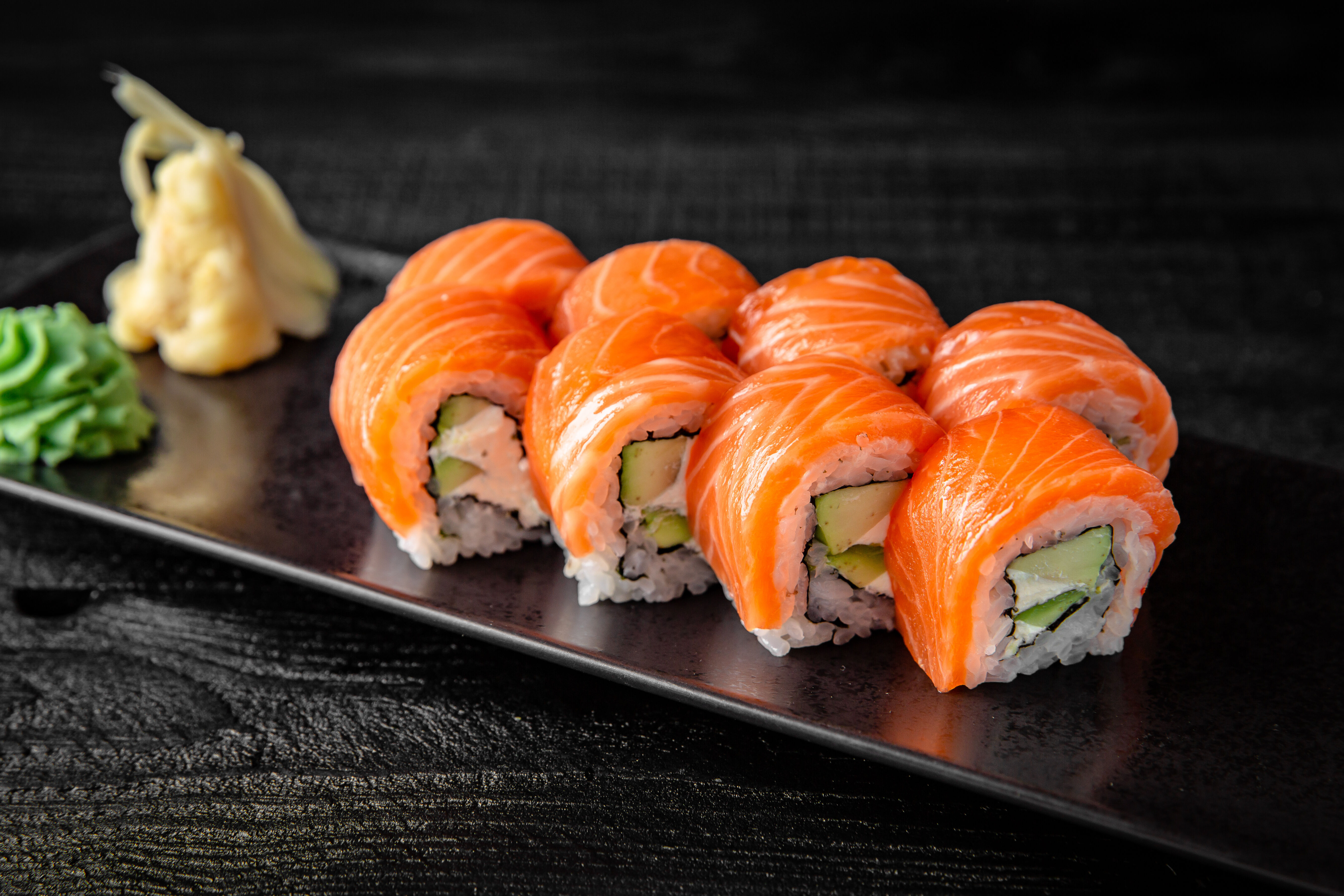 Salmon Sushi roll with ginger and wasabi