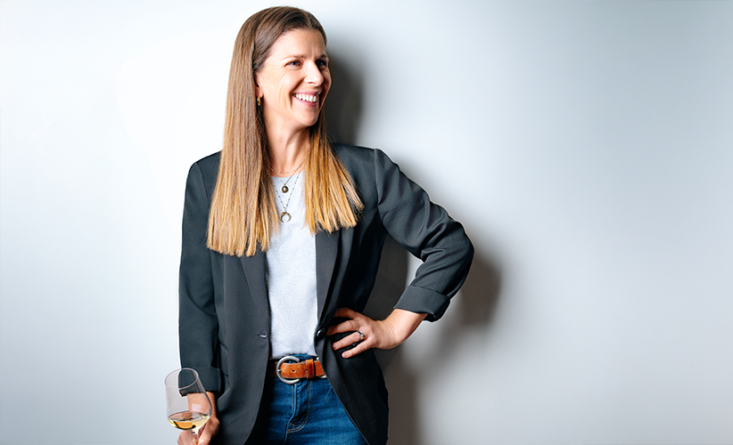 Friends hanging out with La Crema wine on a rooftop