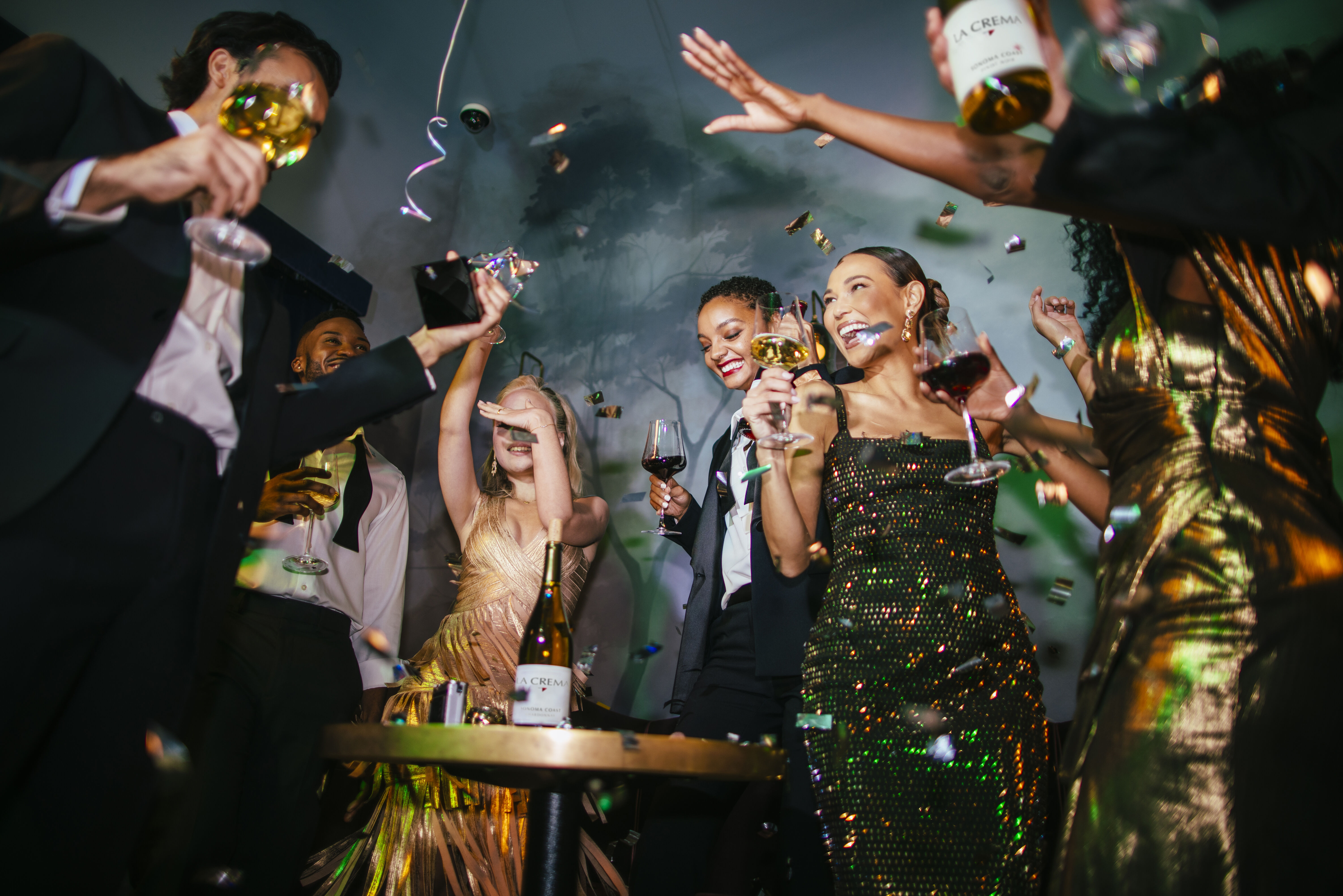 Friends celebrating with La Crema wine at a New Years Party