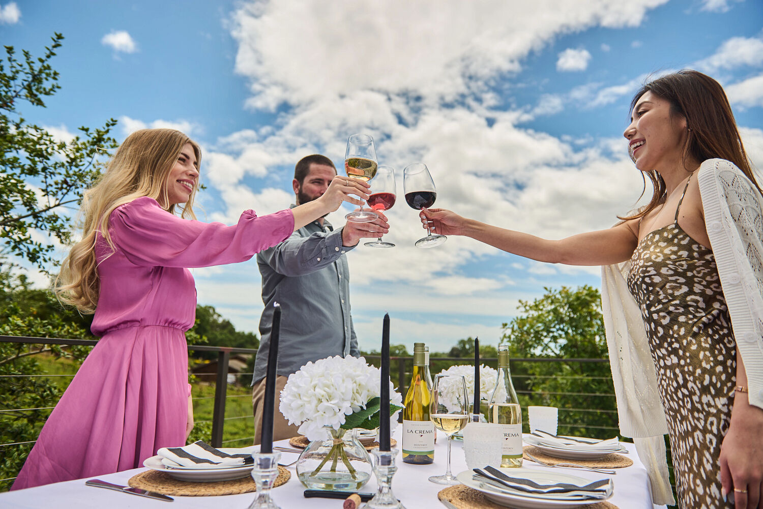 Friends toasting with La Crema wines