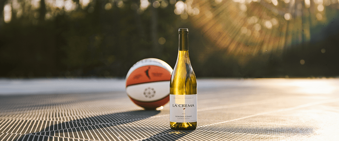 WNBA facts basketball with chardonnay bottle of wine
