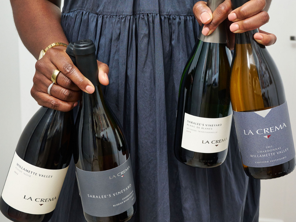 A person holding an assortment of holiday bottles