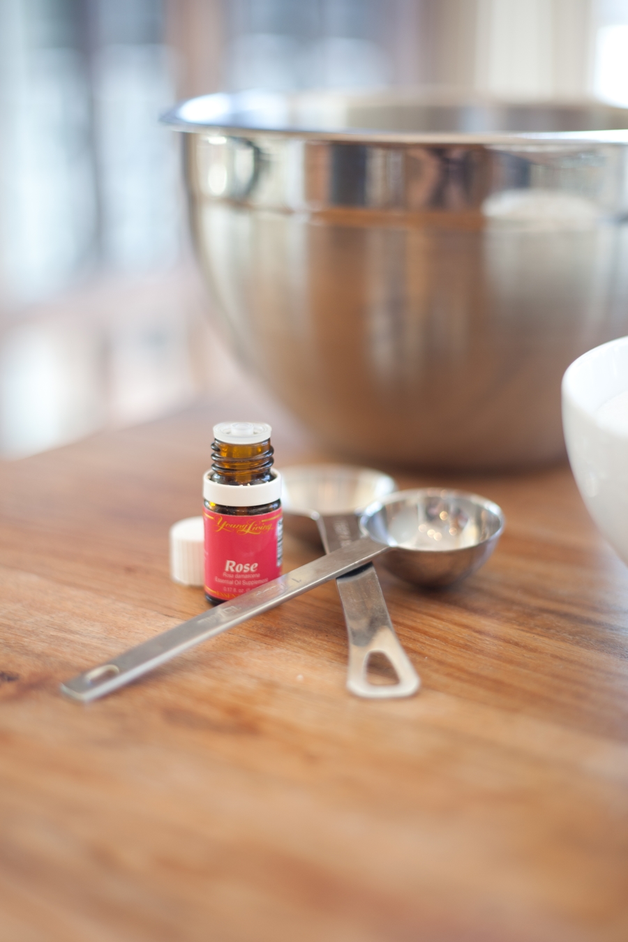 Rose oil and a large bowl for mixing.