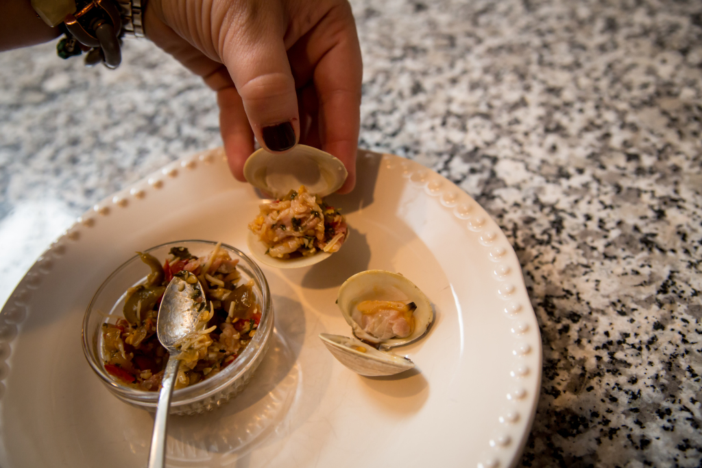 Clams Casino with Pancetta: Portioning the clams into each shell.