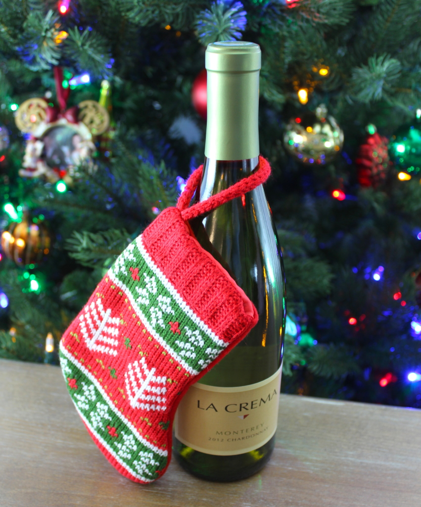 Wine with a mini stocking: One of three easy DIYs to wrap a bottle of wine in another present this holiday season.