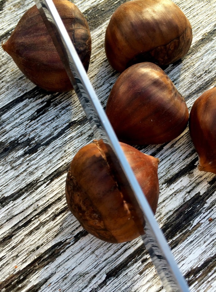 Slicing chestnuts prior to roasting.