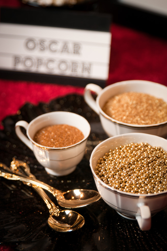 An assortment of edible golden sprinkles + glitter for a dessert bar