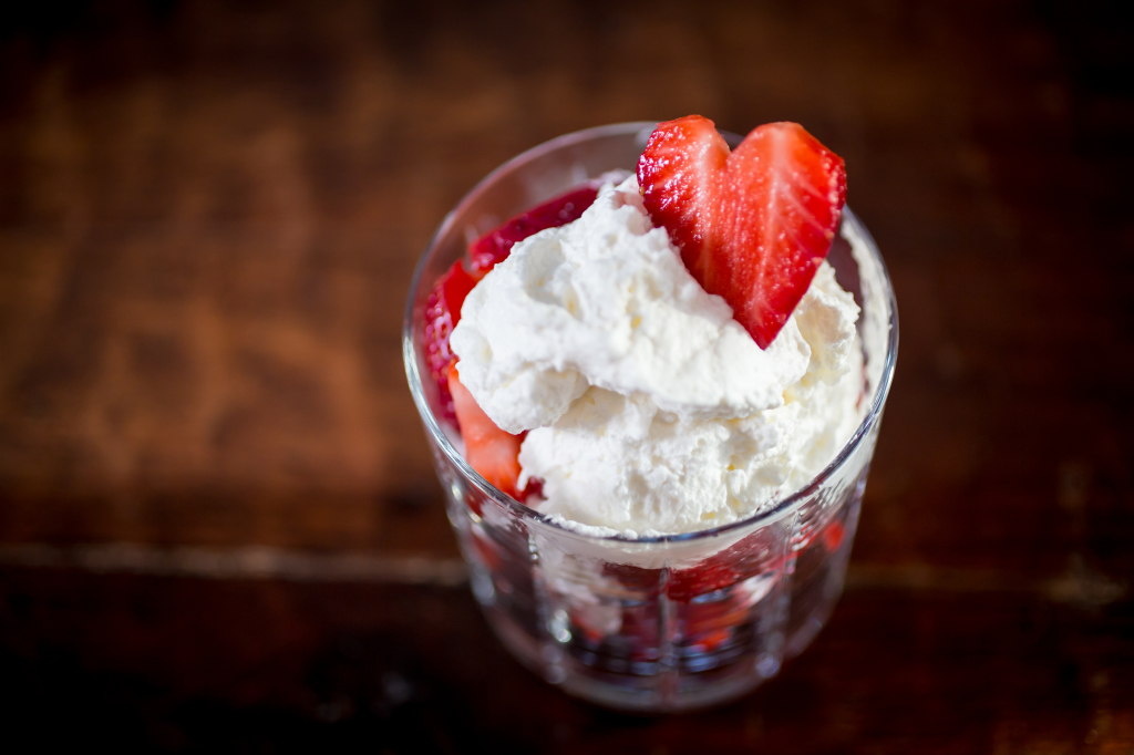 Strawberry parfait with a heart-shped berry garnish