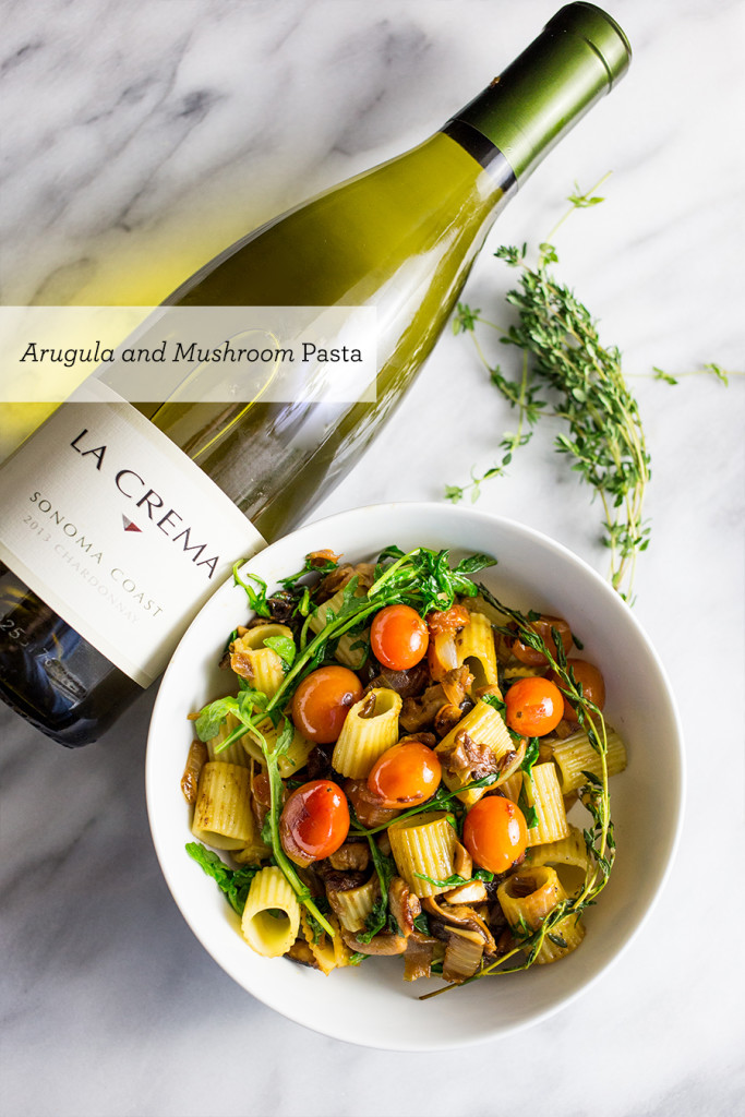 Arugula and Mushroom pasta with a light fresh tomato and chardonnay sauce- this is an insanely delicious but incredibly easy dish!