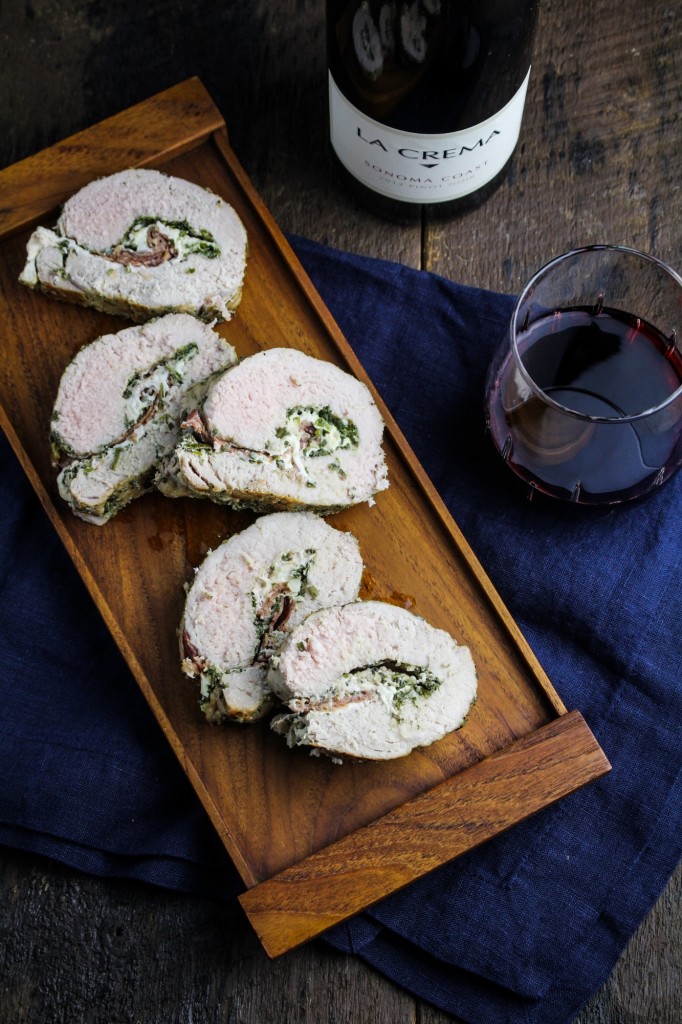 Prosciutto, Mozzarella & Sage Pesto Stuffed Pork Tenderloin: This stuffed and rolled pork tenderloin may not be strictly traditional, but it takes all of its inspiration from Italian cuisine. Butterflied and filled with layers of sage and rosemary pesto, fresh mozzarella cheese and prosciutto, then rolled up and roasted to juicy perfection. #recipe