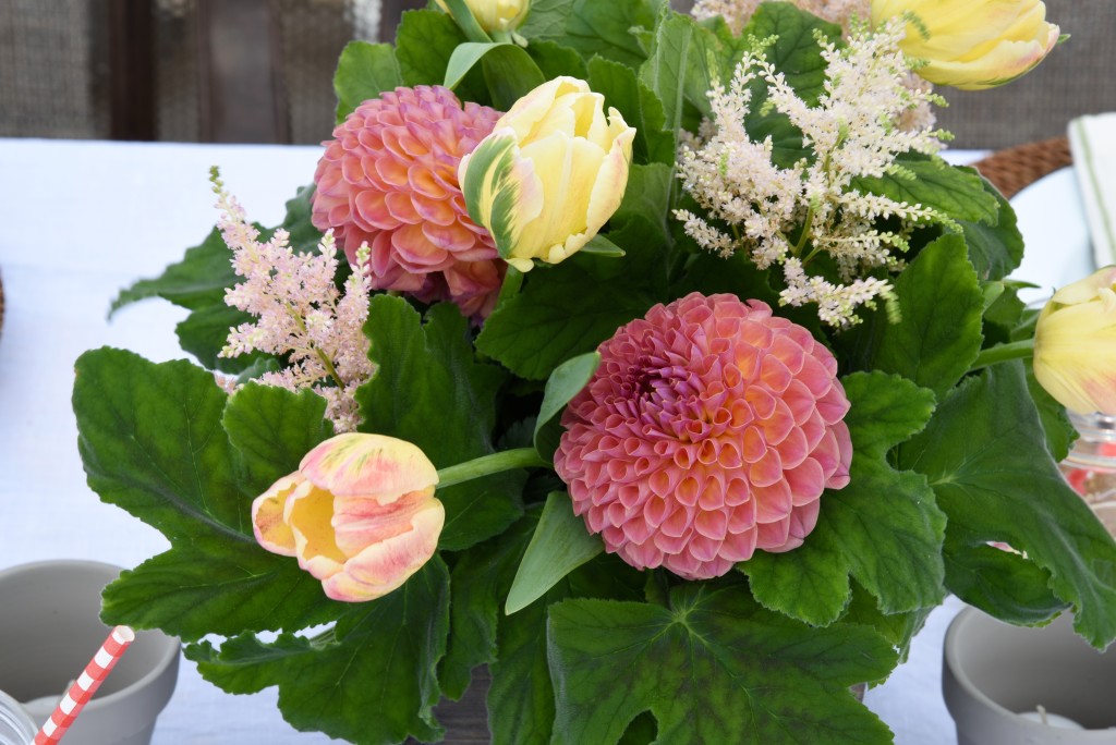 I love the abundance of greenery they used in this arrangement, with pops of orange tulips and gardenia.