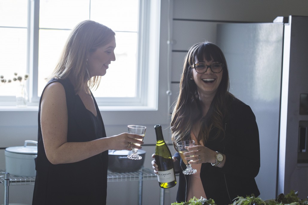 Annie Reeves and Megan Flynn Peterson of Freckled Italian cheersing with La Crema Sonoma Coast Chardonnay