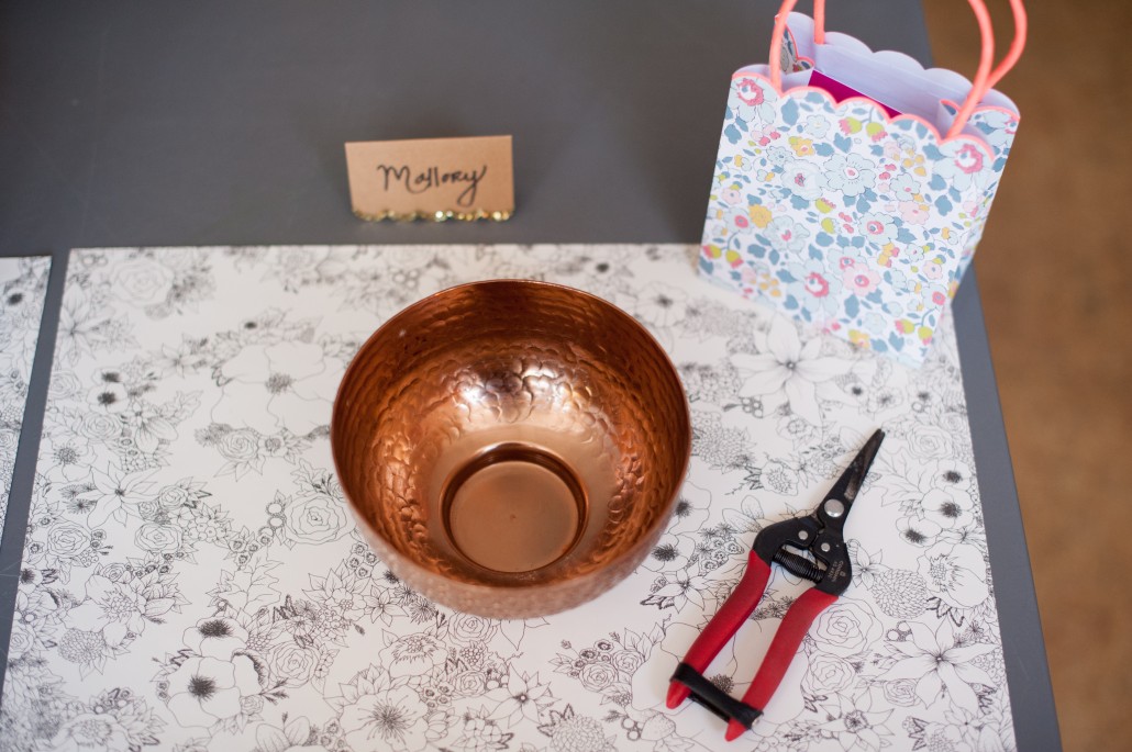 The essentials for getting a flower arranging party started -- coloring book mat (with flowers!), clippers, vase, and a goodie bag.