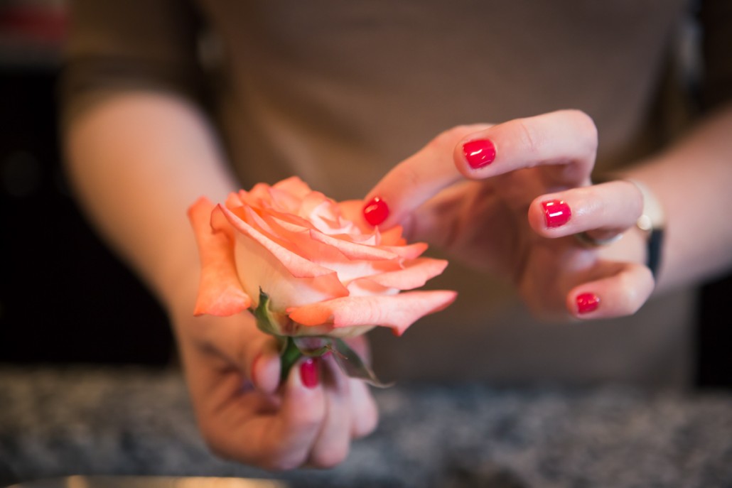 Carefully open up the flower's petals to prep it for it's spherical floral ice globe