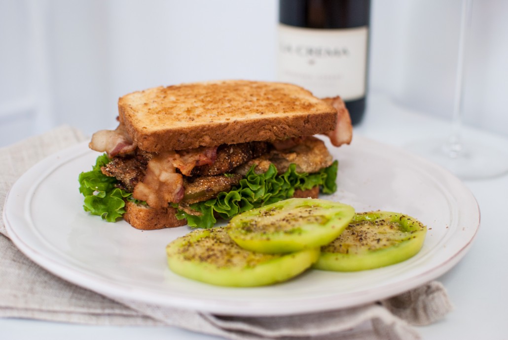 Fried Green Tomato BLT with fresh green tomatoes on the side