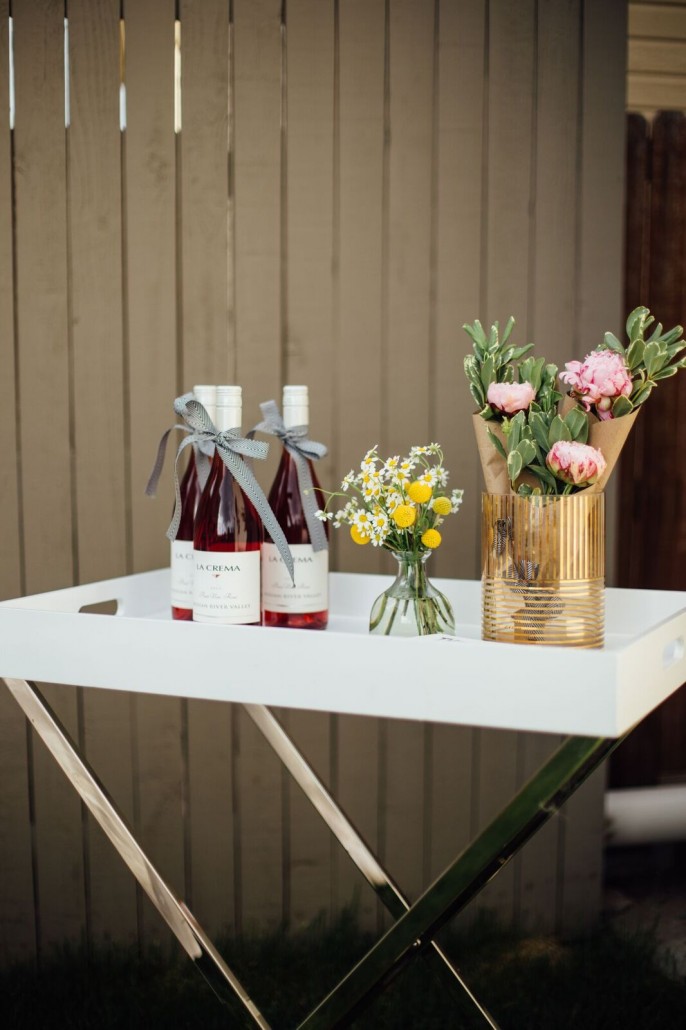 Dress up your bar cart with flowers and have wine ready at your bridal shower