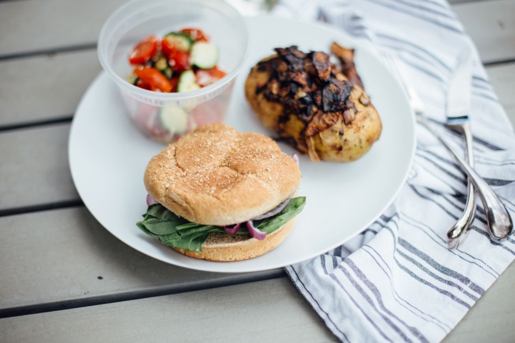 Glamping Meal: Carmelized onion baked potato burger and zucchini, tomato and parmesan salad