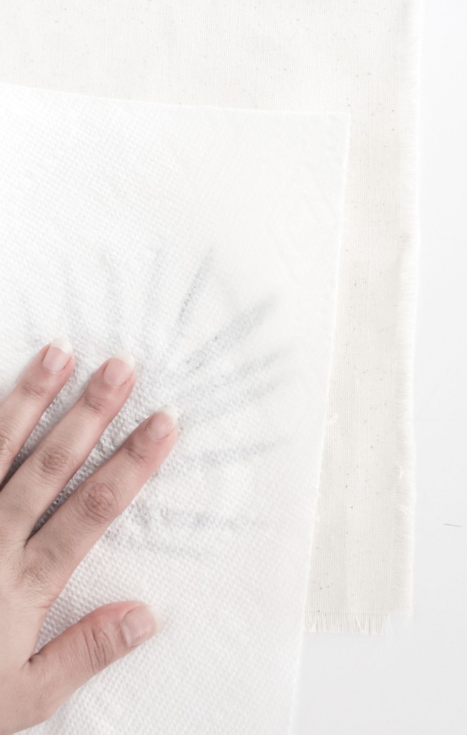 Blot the leaf with a paper towel to create DIY Palm Leaf Napkins