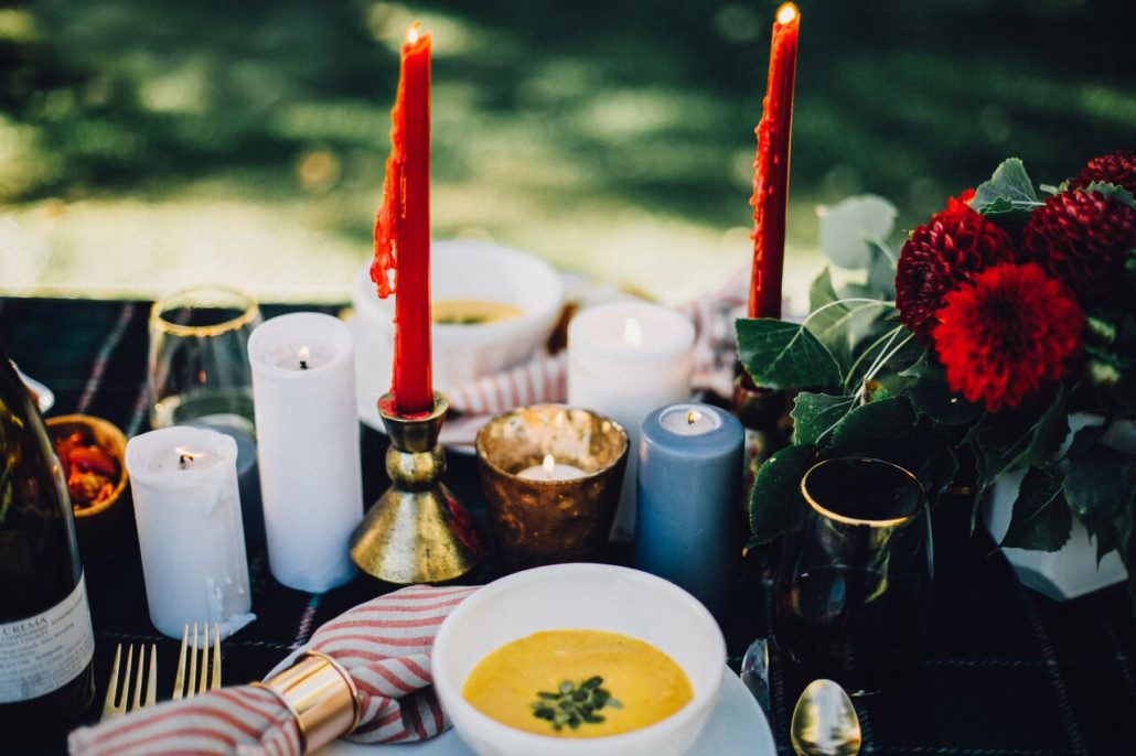 Lots of candles create an inviting setting for a fall al fresco dinner party