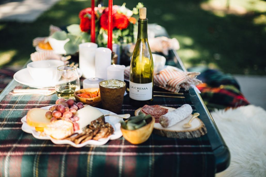 Plaid tablecloth and throws are perfect pieces when hosting a Fall Al Fresco Dinner Party