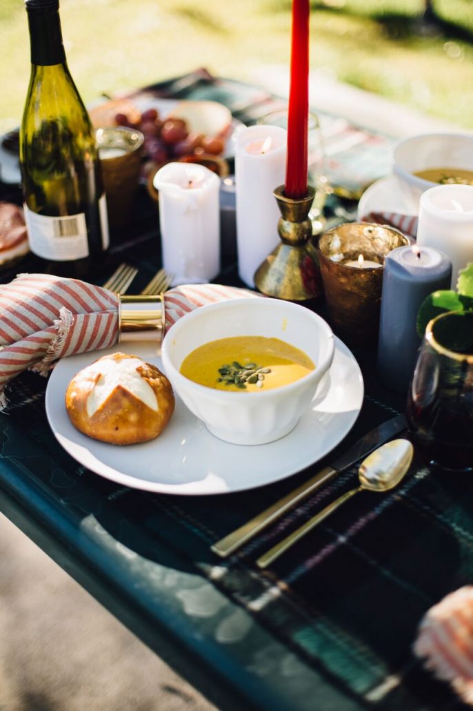 Butternut squash soup and a pretzel roll for a fall al fresco dinner party