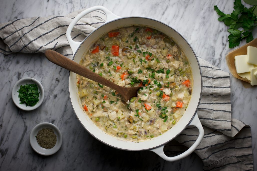 The filling for the chicken pot pie stewing in a dutch oven