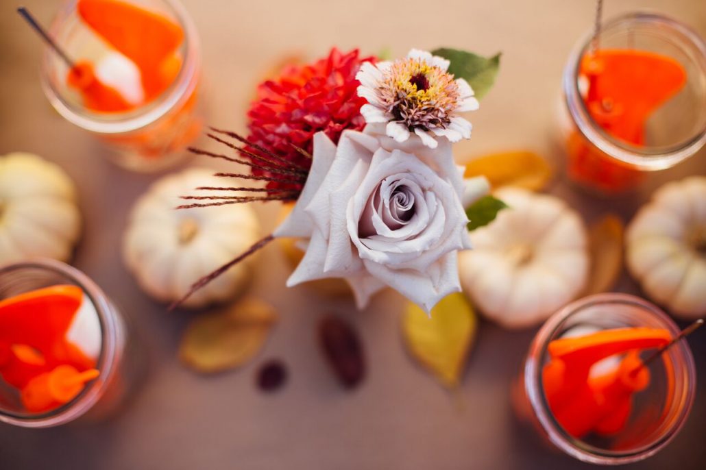 Subtle fall foliage are small gourds are sure to make the table pop! | Pumpkin Carving Party