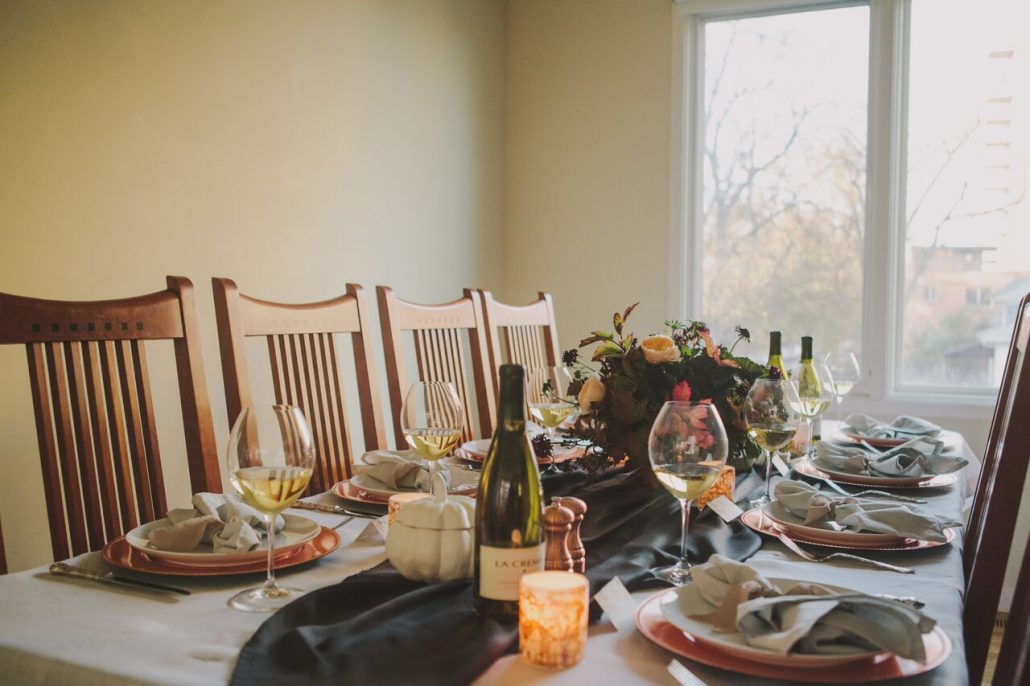 Table is set for a Friendsgiving! Keep things organized and if you're tight on space, go light on the centerpiece so there's more room for the dishes. 