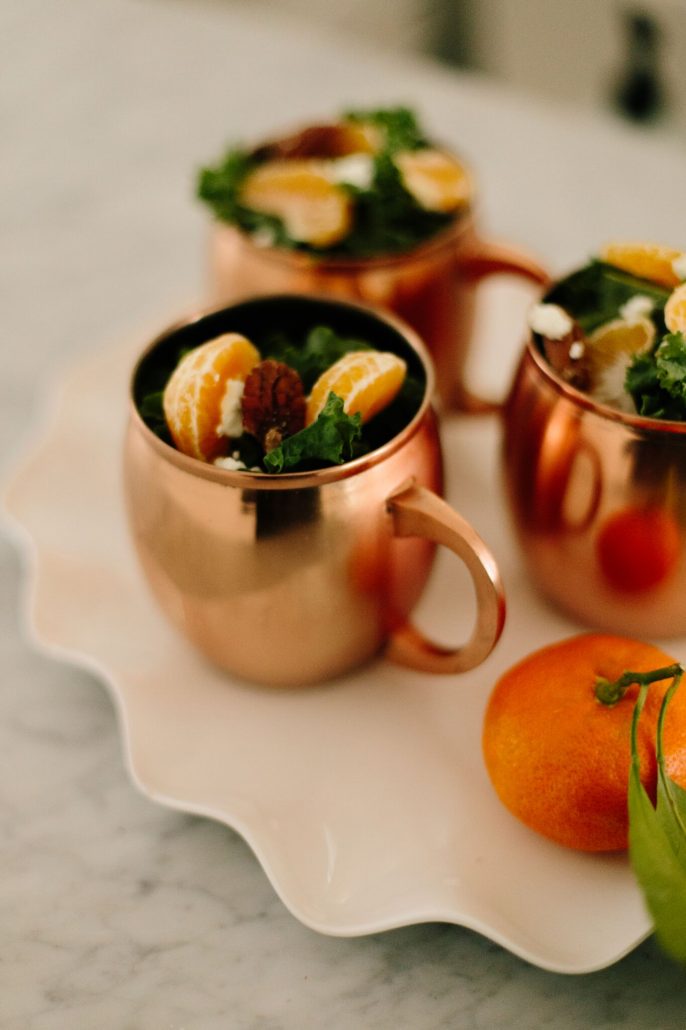 Kale, Clementine and Goat Cheese Salad festively served in Moscow Mule mugs for a New Year's Day Brunch