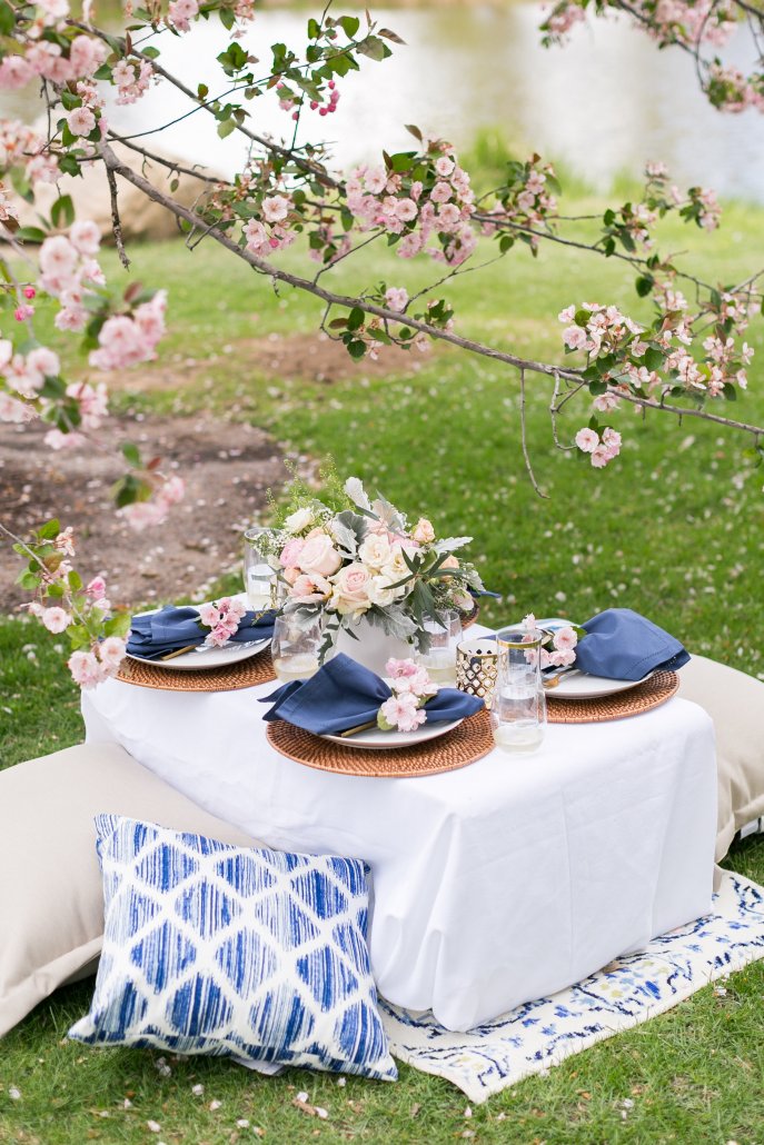 Pull together pillows and an outdoor rug to make things cozy at your spring picnic