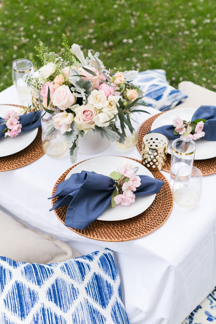 Table setting for a spring picnic in a park or backyard