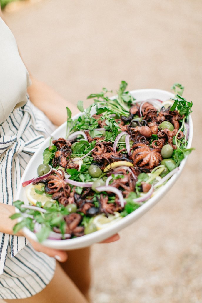 Grilled octopus at a low-key dinner party by Camille Styles