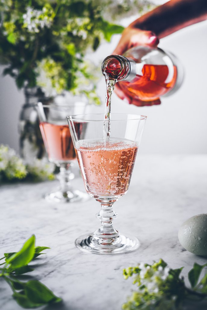 rose of pinot noir pouring into wine glass